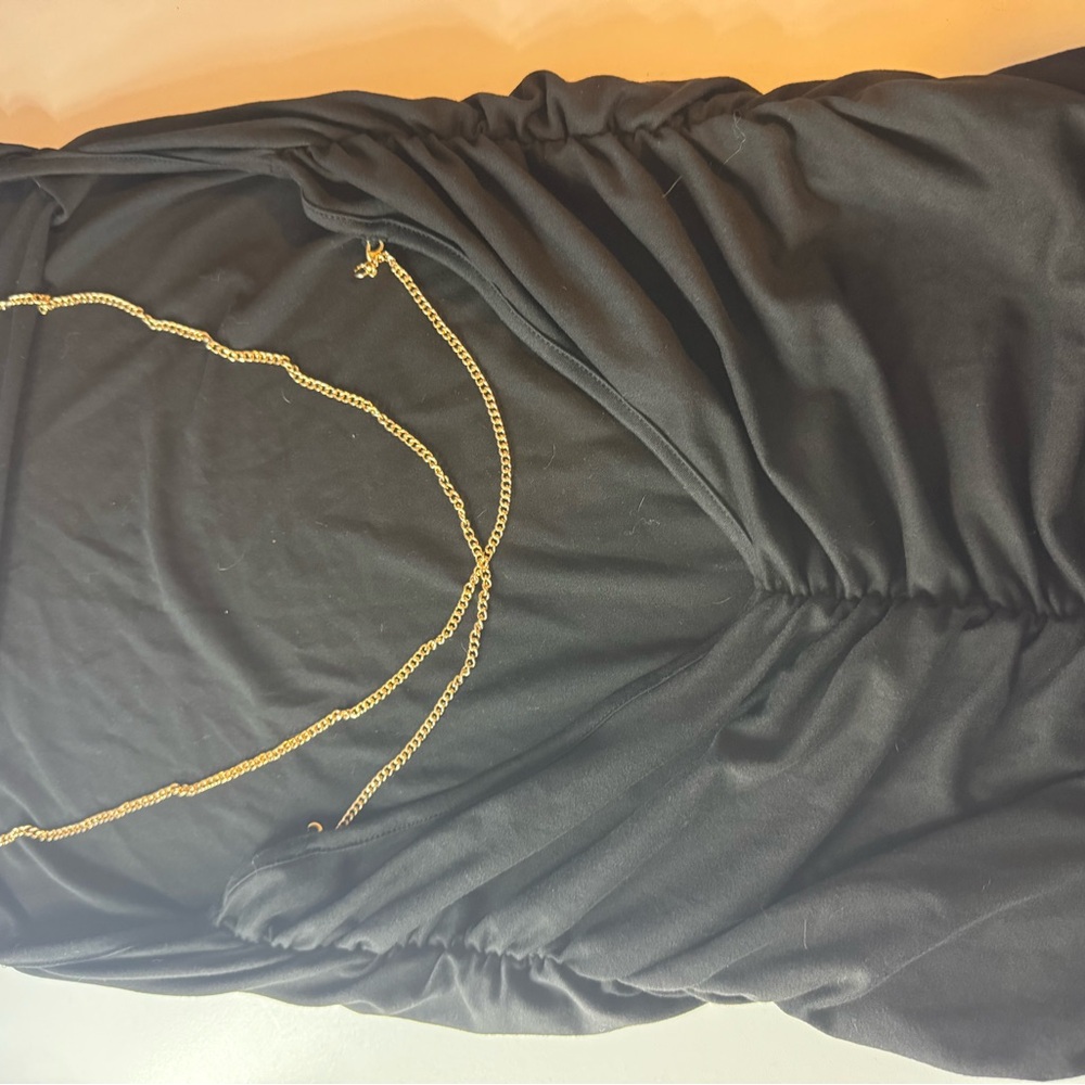 Elegant Black Dress with Gold Chain Detail